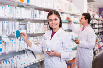 pharmacists posing in drugstore