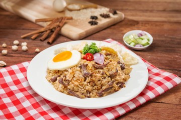 Fried rice with dried beef and egg on the table