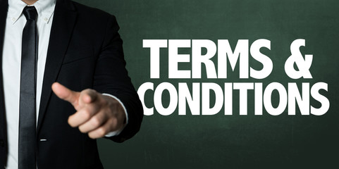 Business man pointing with the text: Terms & Conditions