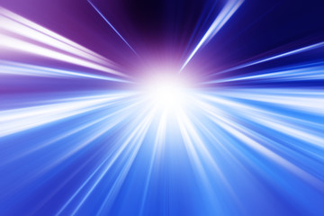 Motion blurred image of traffic lights on the road.