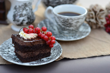 Chocolate pastry with fresh fruit served with a cup of coffee