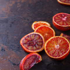 blood orange slices,on a black background.Copy space.selective focus.