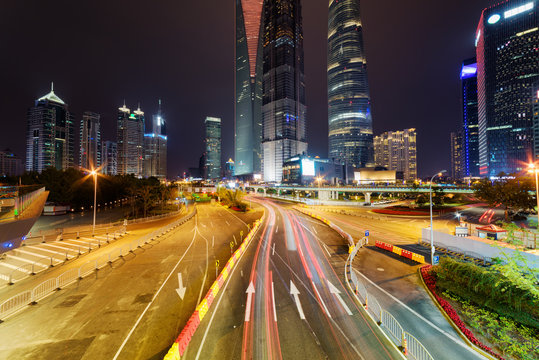 Night view of Century Avenue with famous skyscrapers of Shanghai