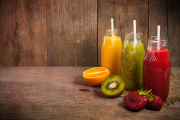 fresh smoothies on a wooden surface.