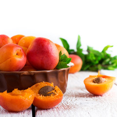 Ceramic bowl with organic ripe apricots