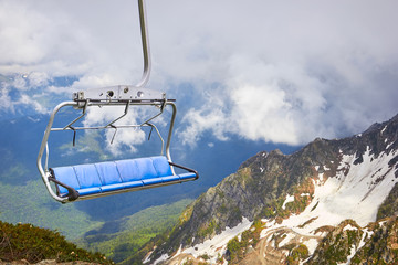 Cable car in the scenic mountains at the summer