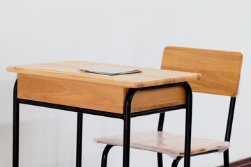 School classroom with school desks with chair on white backgroun