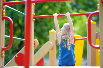 Cute little girl having fun on a playground