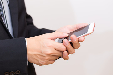 Happy asian man talking on the mobile phone