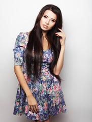 Beautiful brunette female in summer dress 