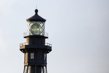 Early morning light shining on the "Big Diamond" Hillsboro Inlet Lighthouse fresnel lens