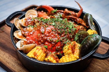 Stew of clams, crabs and corns
