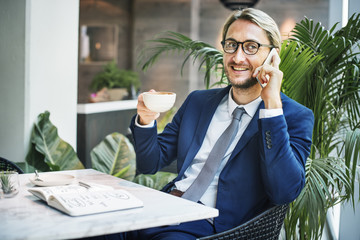 Sitting business Man Drinking Coffee