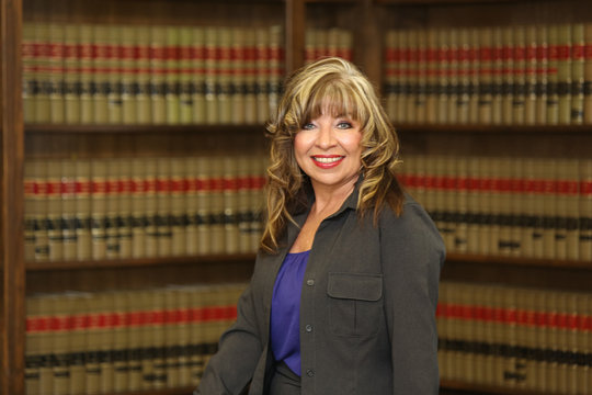 Portrait middle aged attractive career woman, woman lawyer in law office