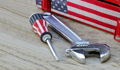 Phillips screwdriver with us flag printed  and lock wrench on wo