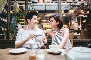 Man and woman drinking a cup of tea
