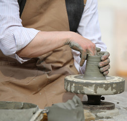 skilled craftsman potter shaping clay
