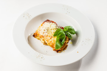 lasagna on the white plate