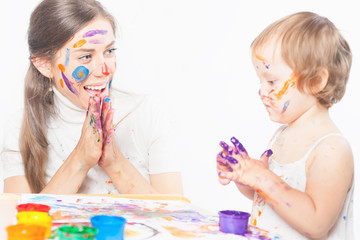 Mom and baby draws with colored inks