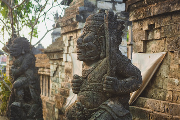 statue at the entrance to the temple, Bali, Indonesia
