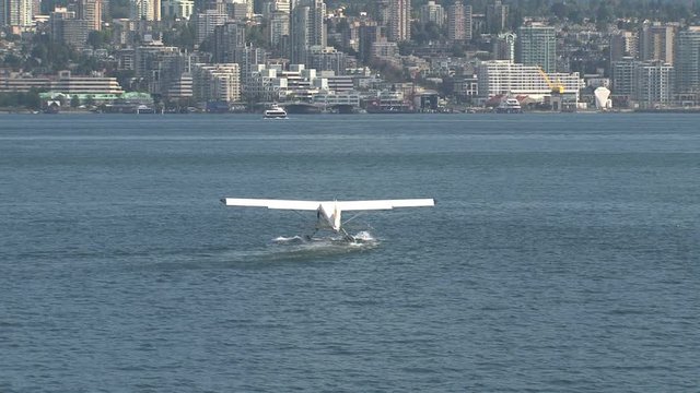 Float plane taking off in harbor Vancouver, British Columbia, Canada