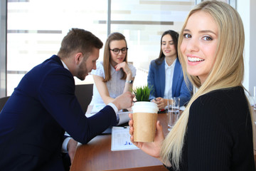 business woman with her staff, people group in background at modern bright office indoors