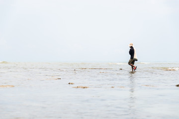 Fisherman on the beach in action when fishing