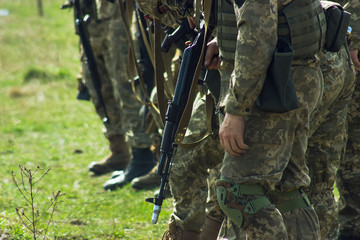 Soldiers standing on guard with a rifle