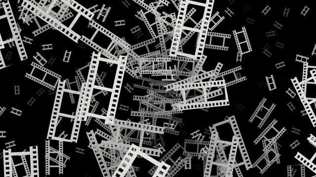 Flying film tape fragments in white on black