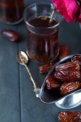 Traditional arabic tea and dry dates.