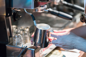 Barista making fresh coffee latte
