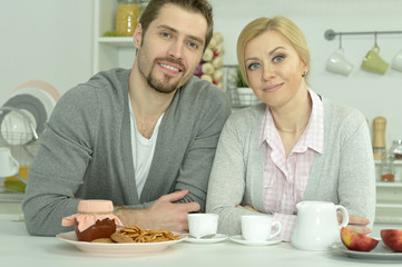 couple at table with coffee and food