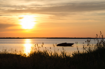 Boat silhouette by sunset