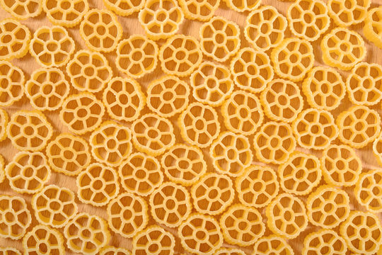 Uncooked italian pasta rotelle as background