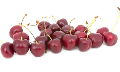 red cherries on a white background