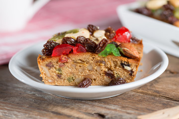 Fruit cake in white plate.