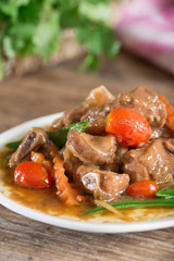 Baked pork ribs with soy sauce and vegetable.