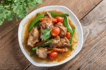 Pork ribs braised with soy sauce and vegetable. Top view.