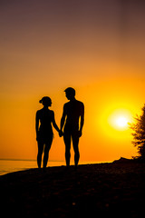 Couple of lover holding hand with sunrise