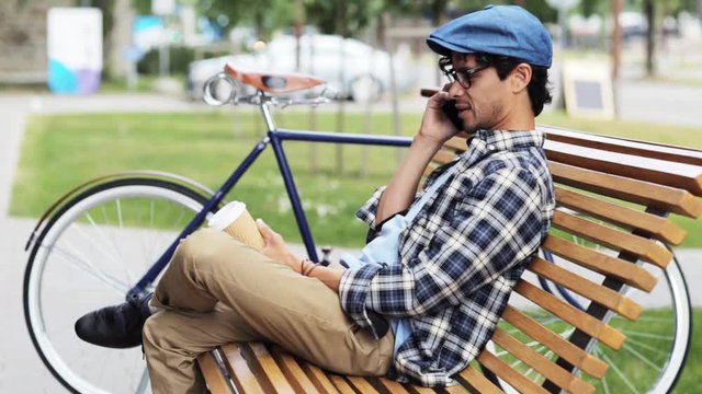 man calling by smartphone sitting on street bench 32