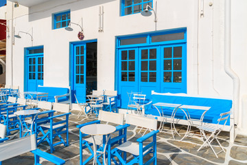 Fototapeta na wymiar Typical Greek tavern in Little Venice, a part of Mykonos town on island of Mykonos, Greece