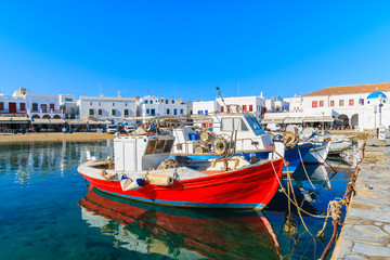 Fototapeta na wymiar Greek fishing boats mooring in Mykonos port on island of Mykonos, Cyclades, Greece