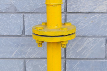 Fototapeta na wymiar Pipe and yellow valve