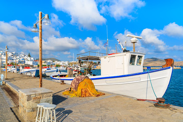 Plakat Typical Greek white fishing boat in Naoussa port, Paros island, Cyclades, Greece