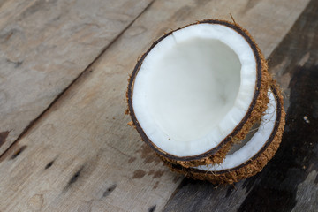 coconut with shell on wooden background