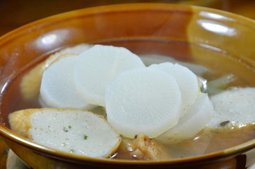 boiled radish and slice fish line hot soup on bowl