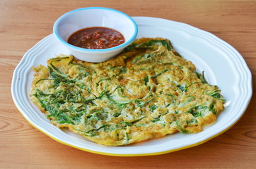 fried egg with climbing wattle dipping shrimp chili paste sauce on dish