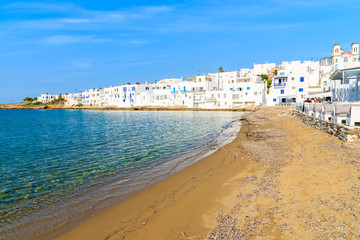 A coastal promenade in Naoussa port with traditional white Greek architecture, Paros island, Cyclades, Greece