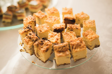 Delicious and tasty dessert table with cupcakes  shots at reception closeup