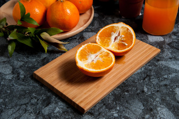 Obraz na płótnie Canvas Fresh orange fruits and juice on marble table. Flat lay.